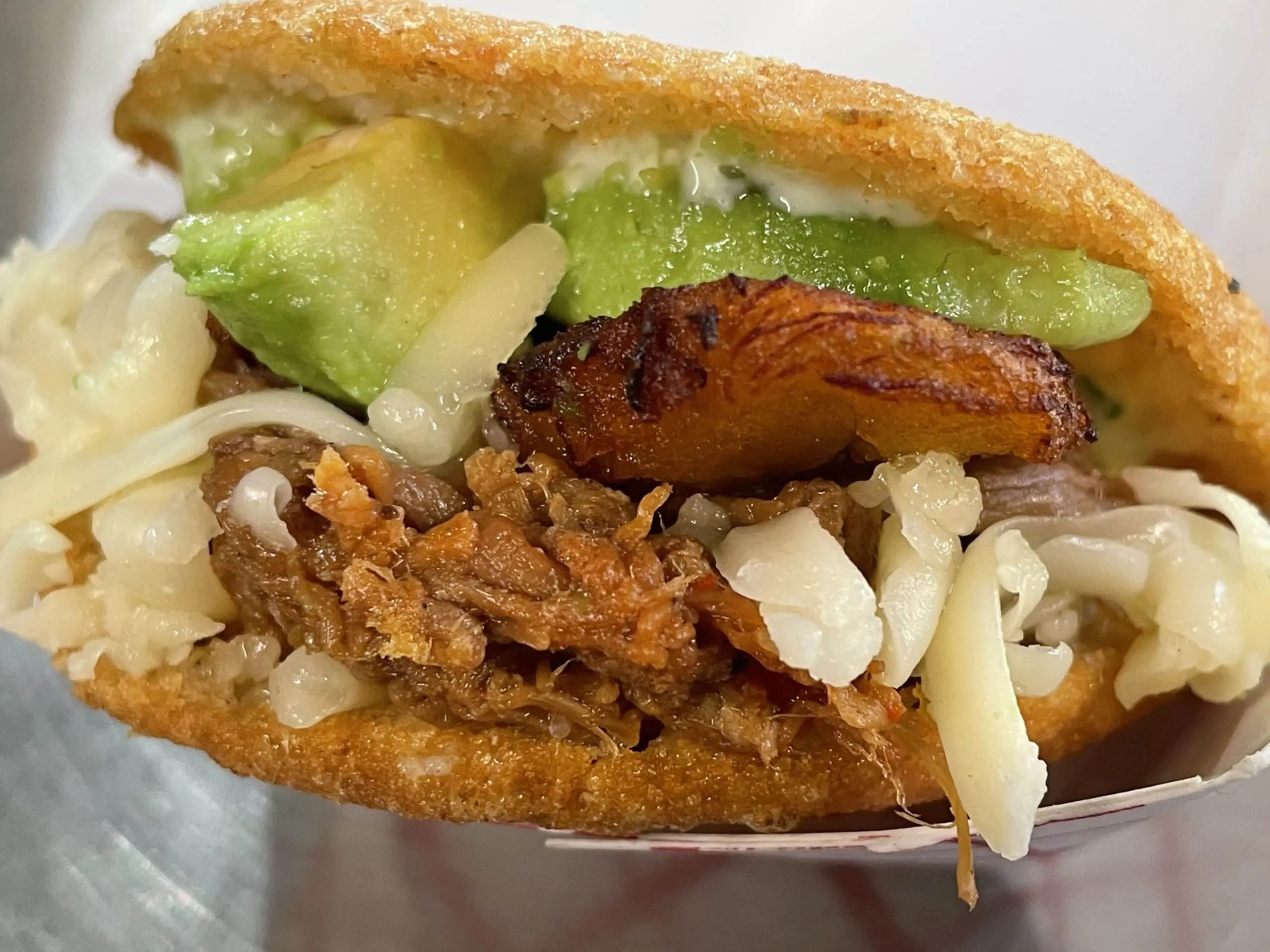 Special Arepa made with Sweet Plantains, Beans, Cheese, and Avocado from Caripito's Food Truck