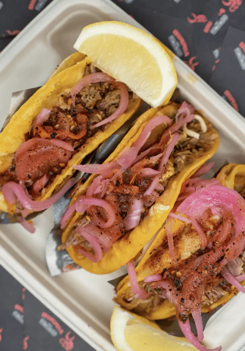 El toro rojo beed birria tacos with pickled onions and side of lemon