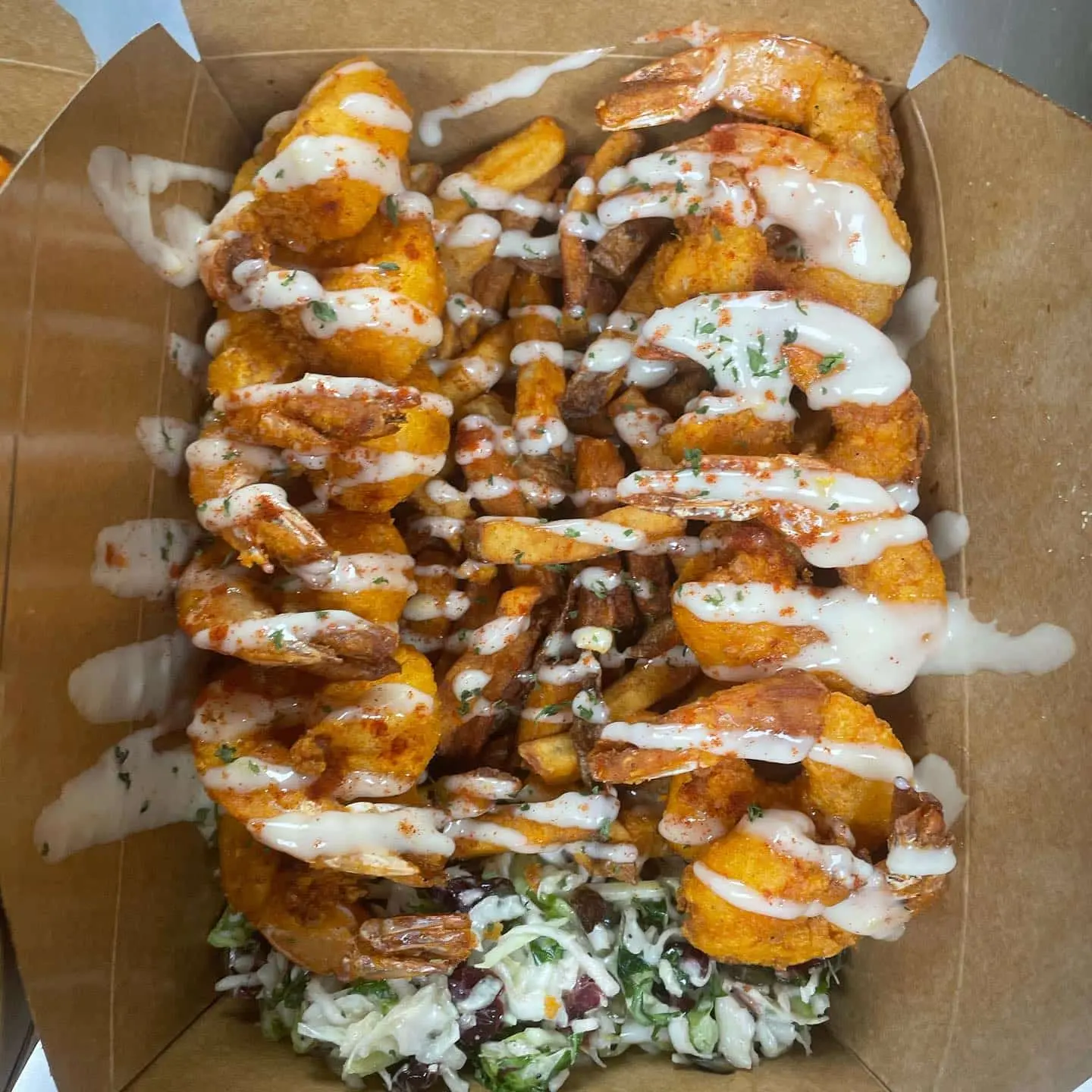 Fried shrimp, french fries, and coleslaw